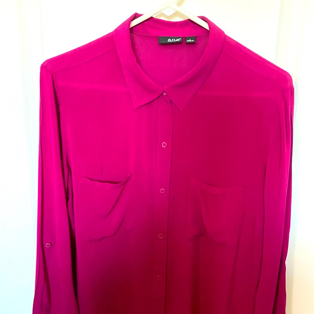 Beautiful Fuchsia Blouse with loose fitting flow. Button up with pockets. Size L
